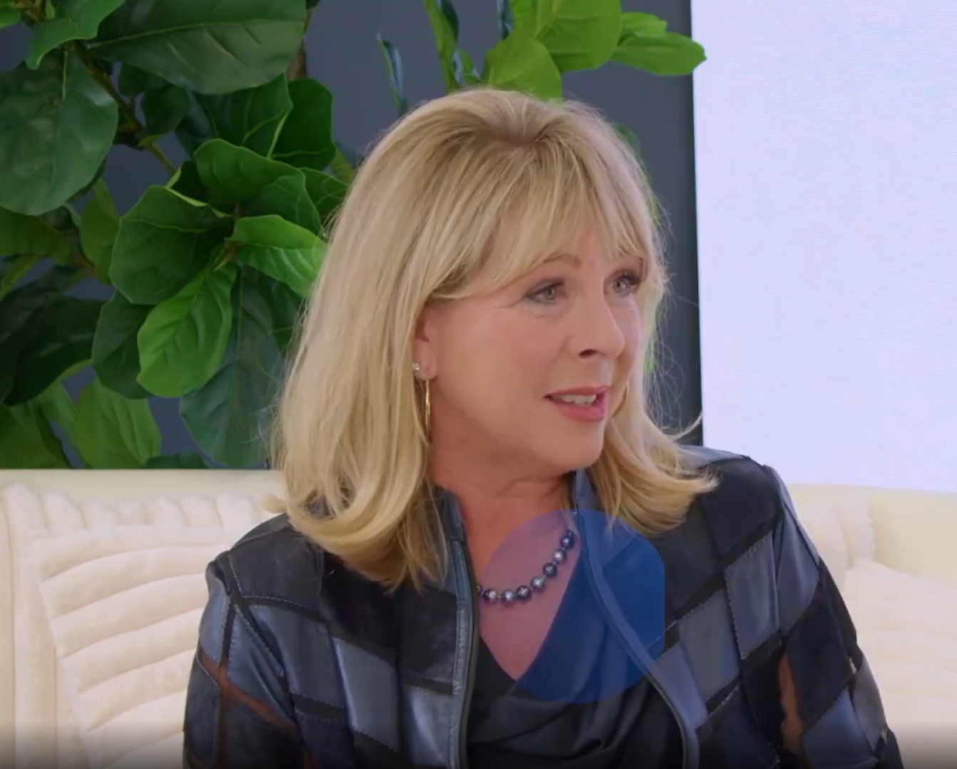 Wendi LeVigne listening during a podcast interview